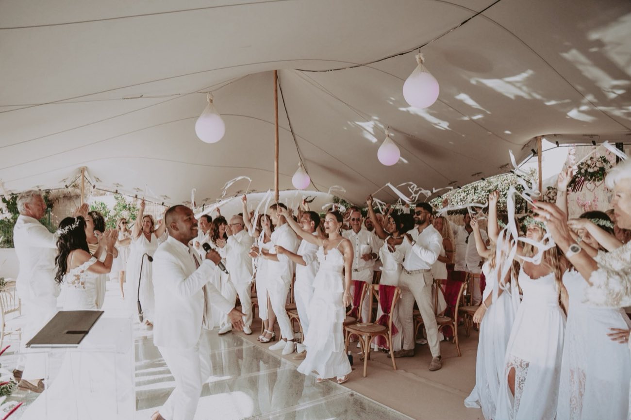 Wedding Band Mallorca — guests celebrating with the band under a white wedding tent